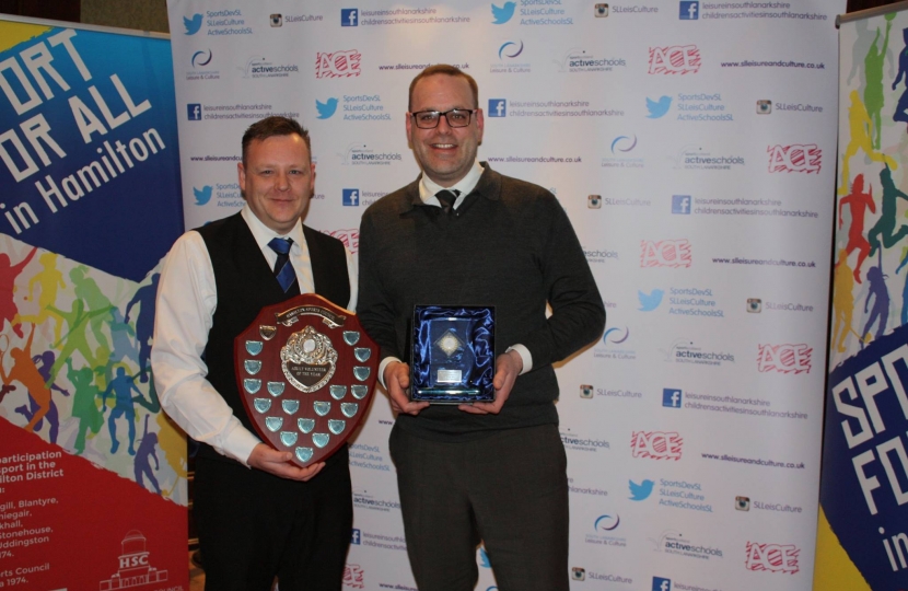 Cllr Hose (right) presents the volunteer of the year award to Gordon Lindsay  of Hamilton Rugby Club