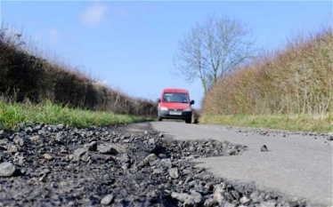 South Lanarkshire's Conservative councillors proposed an extra £2.1m investment in local roads. The bid was blocked by the SNP.